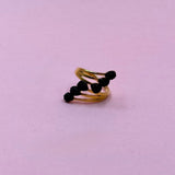 Black flowers gold ring